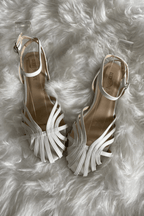 Braided platform slide sandals in white with metallic trim and crisscross toe straps