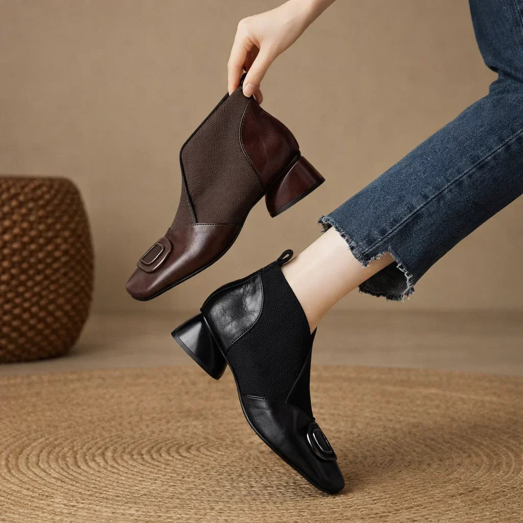 Brown leather square-toe ankle boots with elastic side panels and embossed circular logo