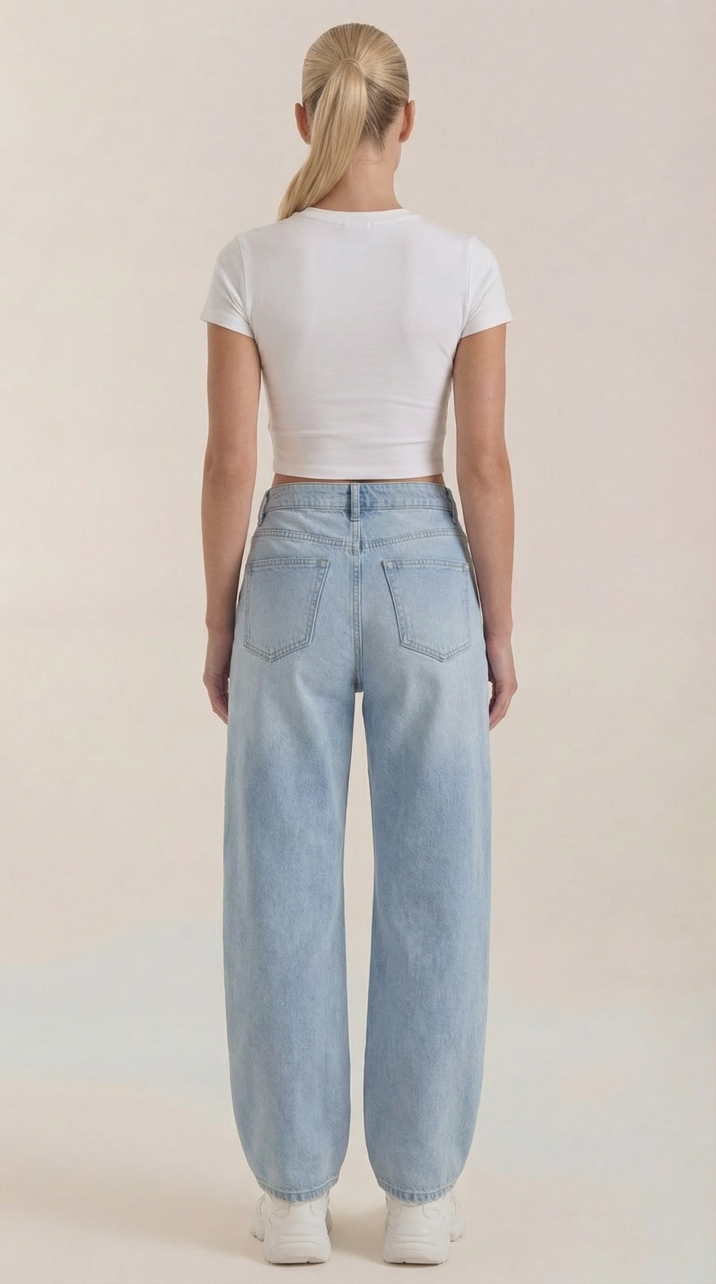 Light blue wide-leg jeans viewed from the back with back patch pockets