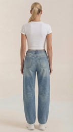 Light blue wide-leg jeans viewed from the back with back patch pockets