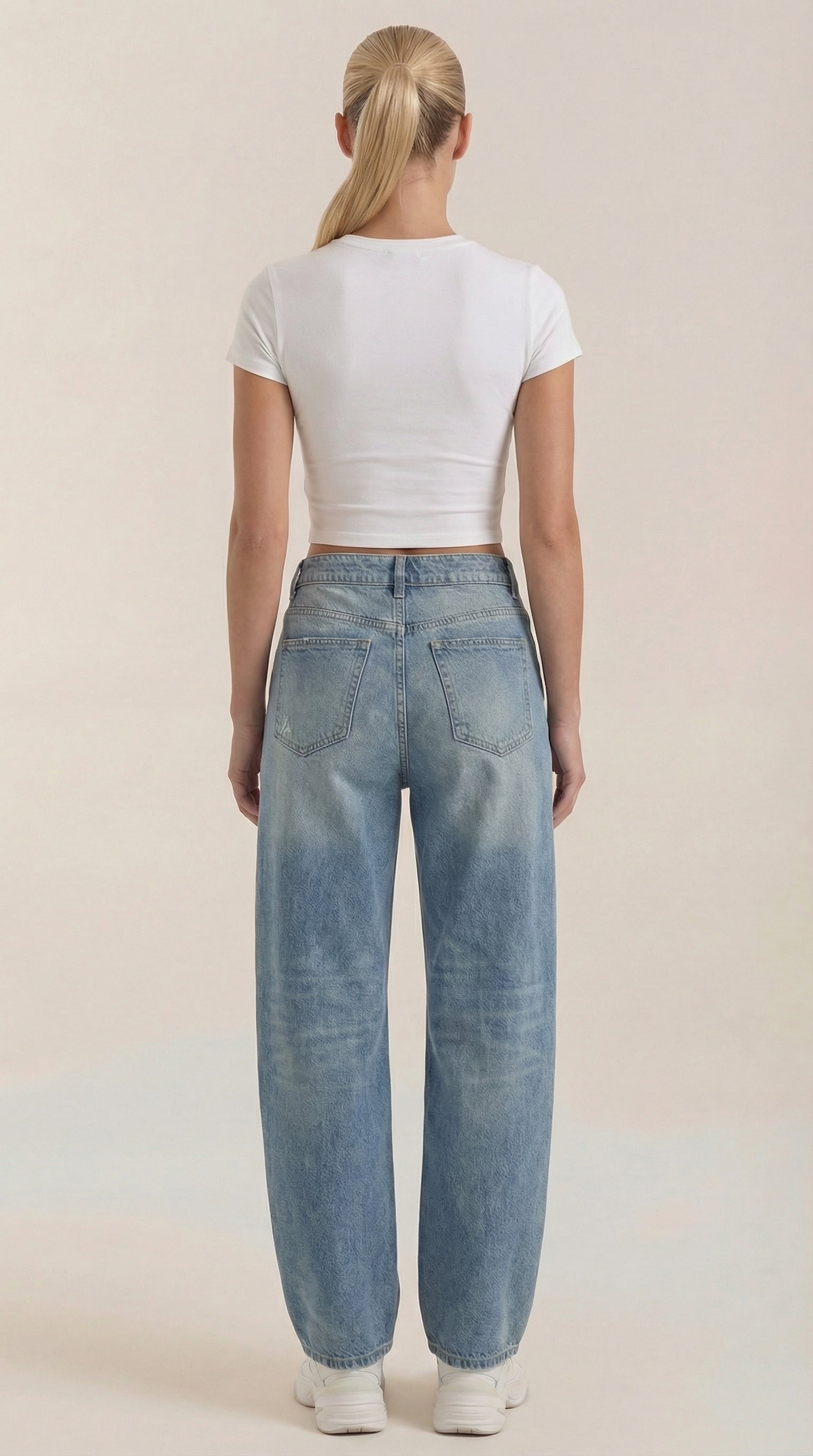 Light blue wide-leg jeans viewed from the back with back patch pockets
