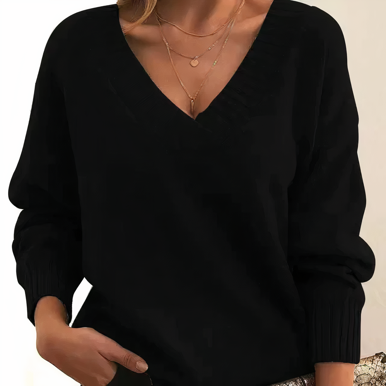 Black cashmere V-neck sweater with ribbed cuffs and relaxed balloon sleeves