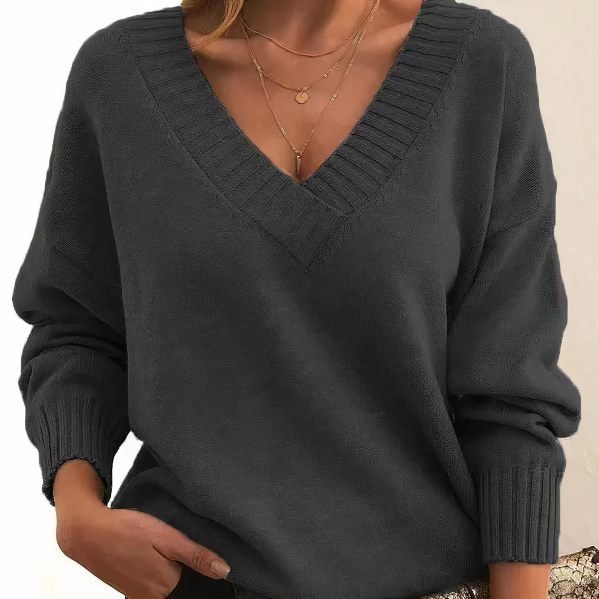 Dark grey cashmere V-neck sweater with ribbed trim and relaxed balloon sleeves