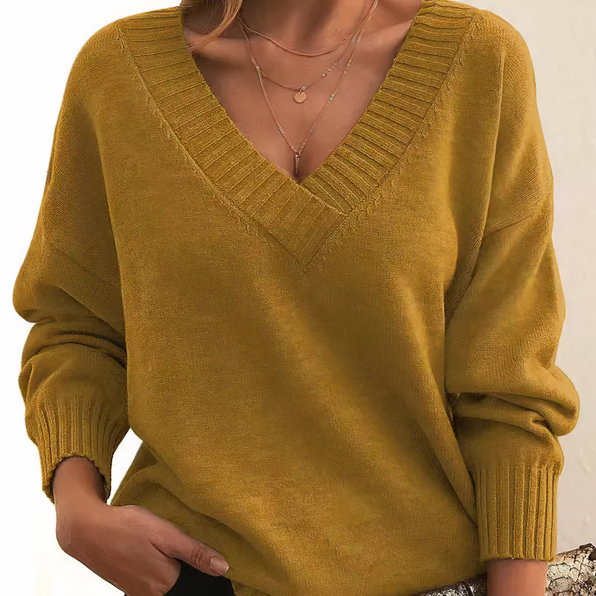 Mustard yellow cashmere V-neck sweater with ribbed trim and relaxed balloon sleeves