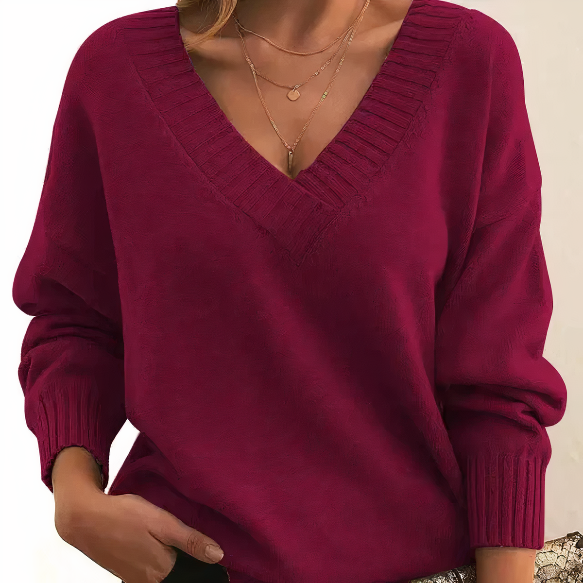 Burgundy cashmere V-neck sweater with ribbed V neckline and relaxed balloon sleeves