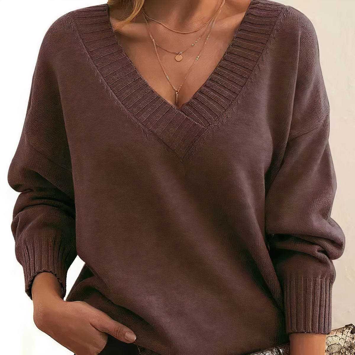 Dark brown cashmere V-neck sweater with ribbed cuffs and relaxed balloon sleeves