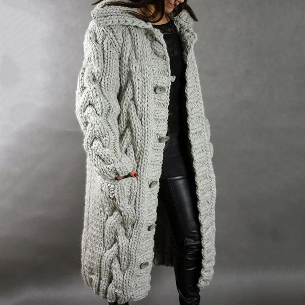 Light grey hooded chunky cable knit cardigan with button front and side pockets