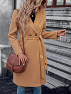 Beige long A-line coat with double-breasted front and waist belt tie, front view