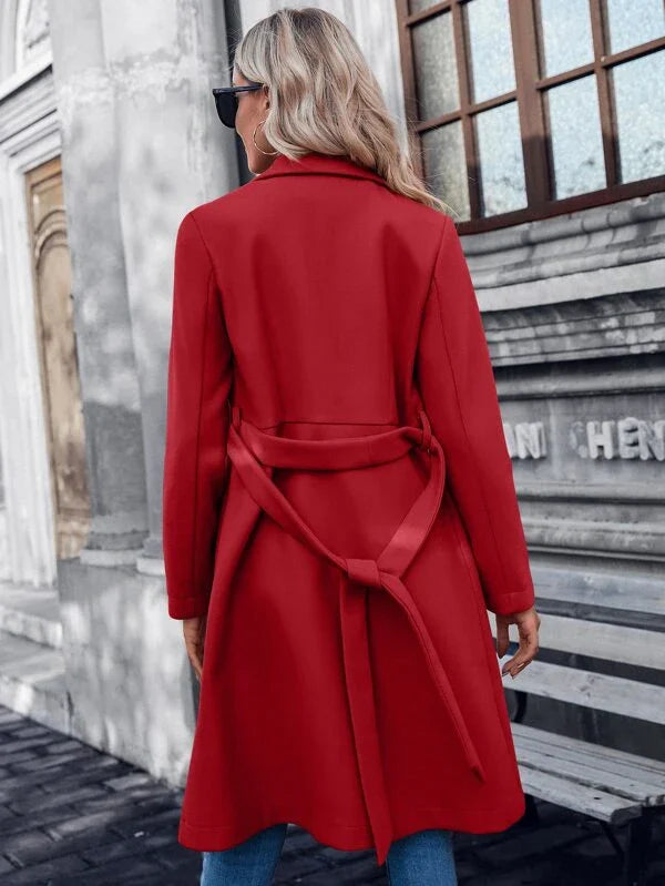 Red double-breasted A-line coat, back view with tied waist belt and long sleeves