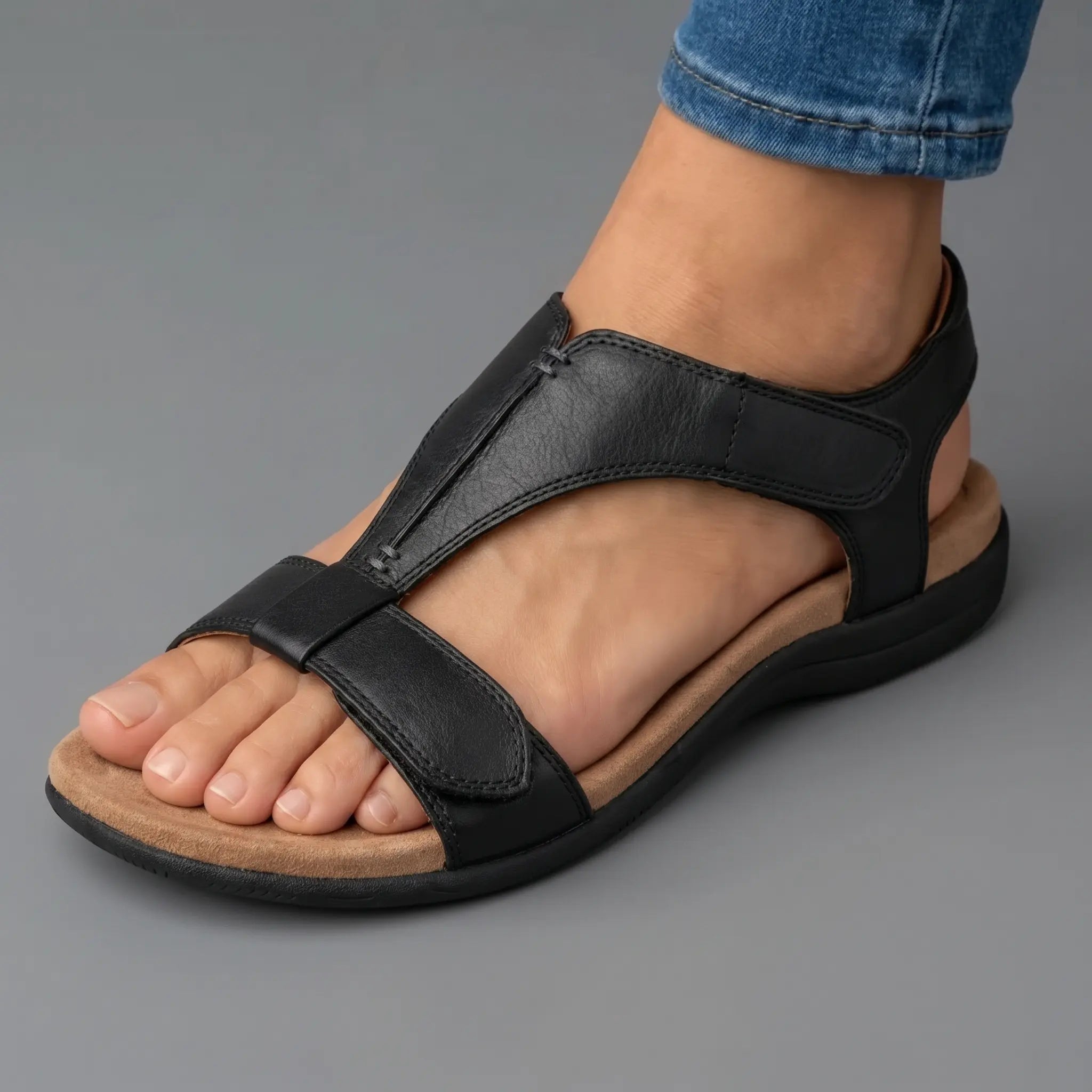 Black adjustable strap sandals with open toe and cushioned wedge sole