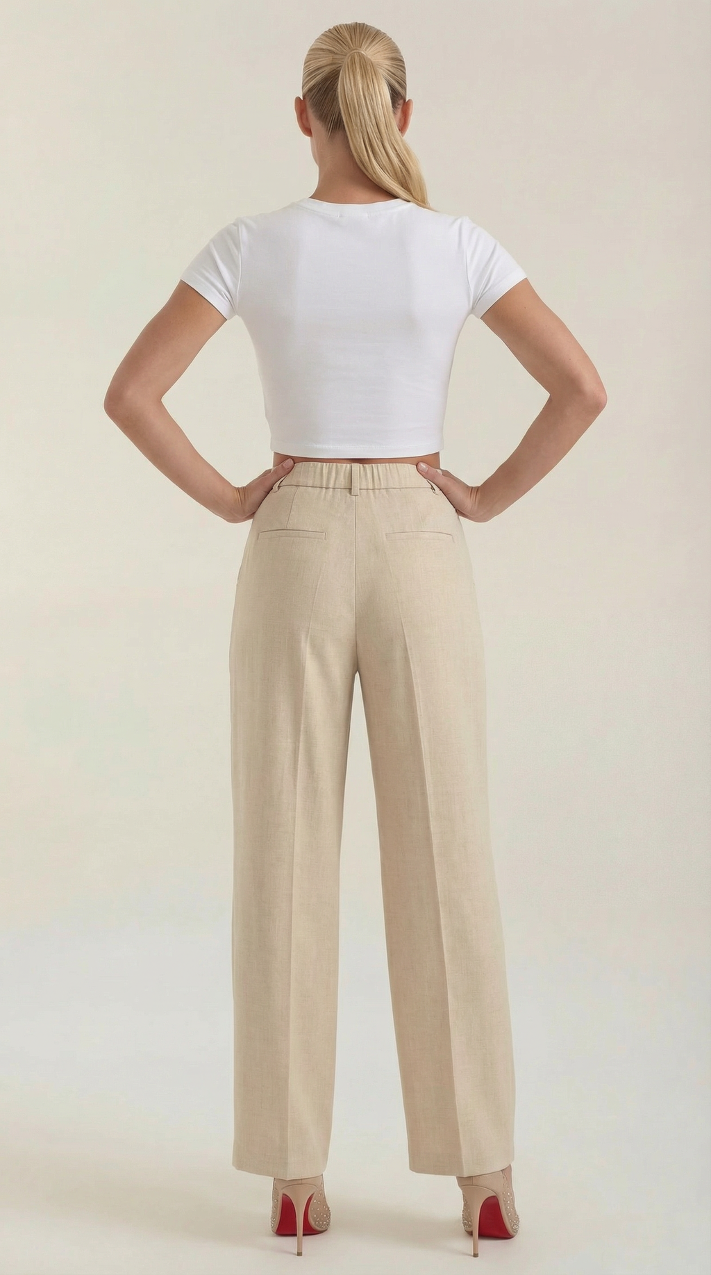 Pleated high-rise wide-leg pants in beige, high waist and wide cropped-leg hem