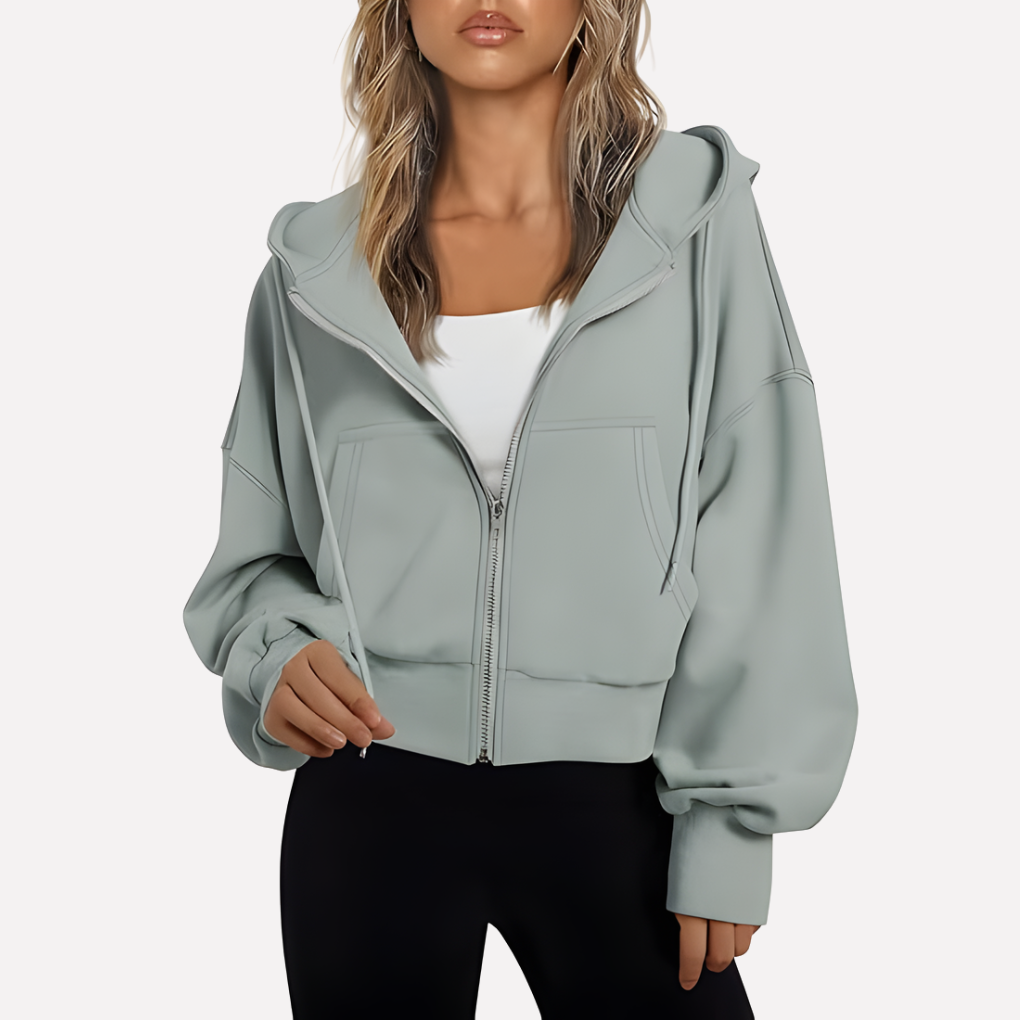 Women's zip-front cropped hoodie in sage gray with hood, drawstring, and front pockets