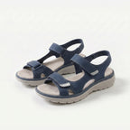 Cushioned adjustable casual sandals in dark blue with two hook-and-loop straps