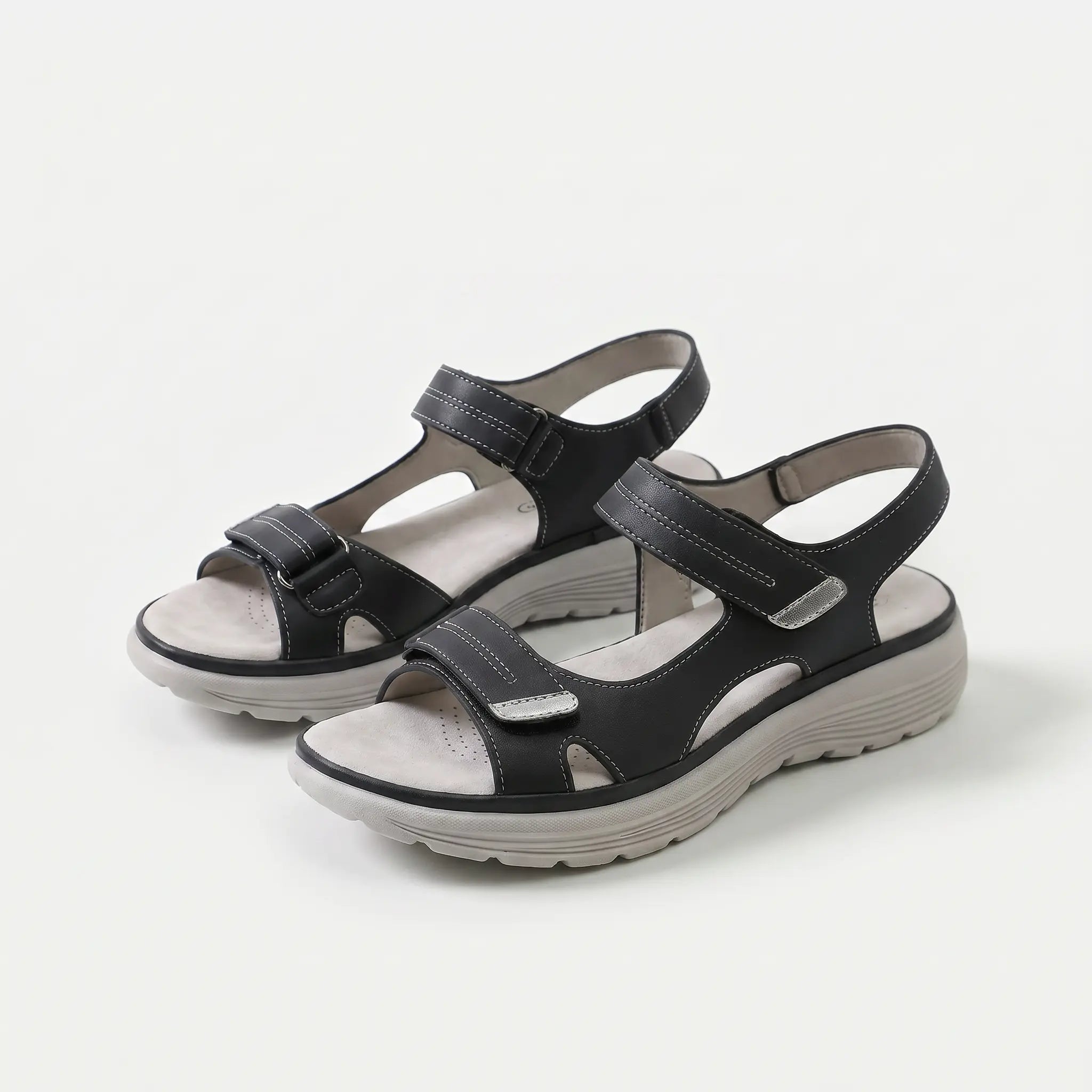 Cushioned adjustable casual sandals in black with two hook-and-loop closure straps