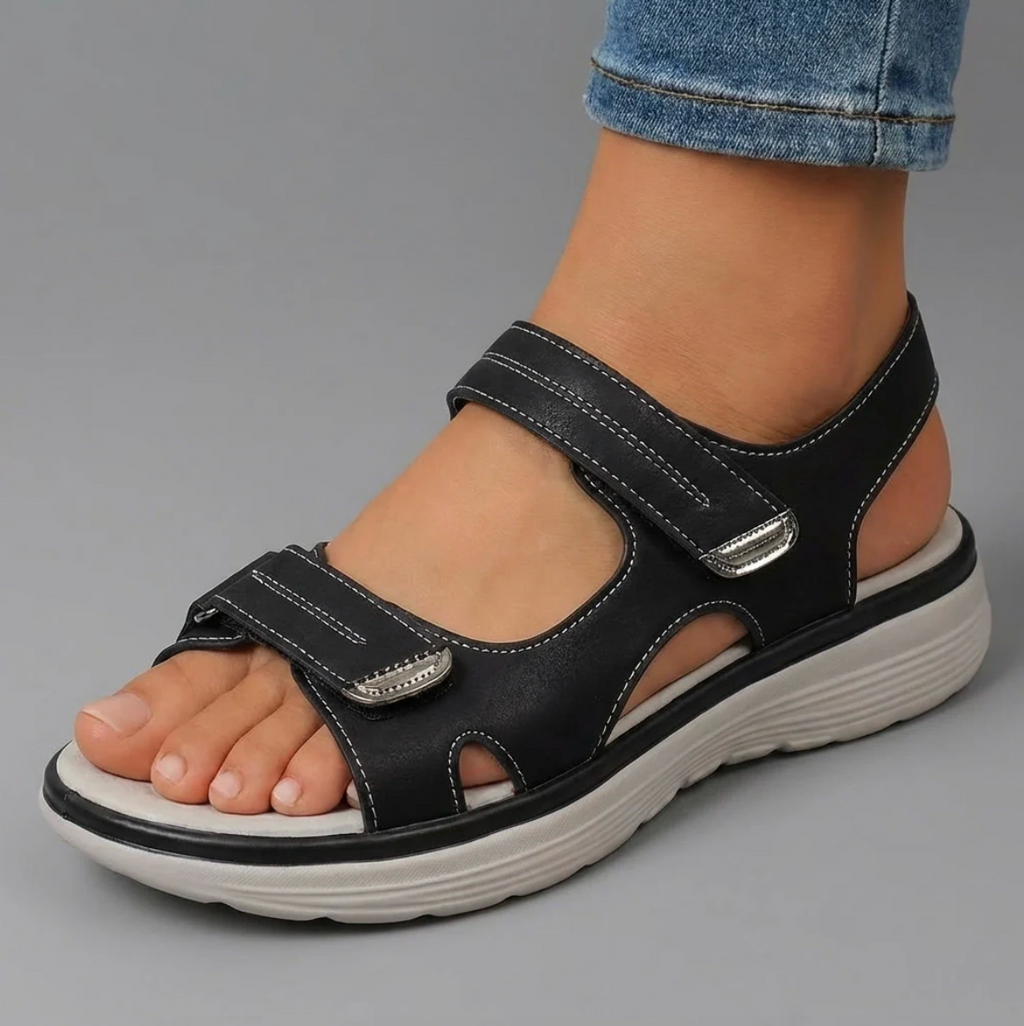 Cushioned adjustable casual sandals in black with hook-and-loop closure straps
