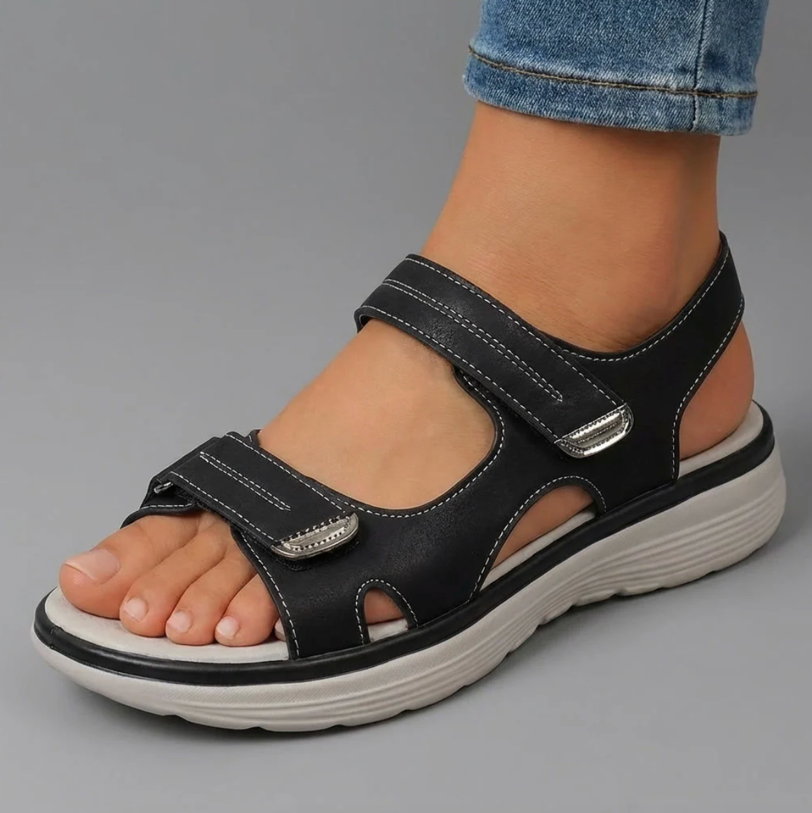 Cushioned adjustable casual sandals in black with hook-and-loop closure straps