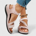 Pink cushioned wedge sandals with adjustable ankle strap and open toe, black sole
