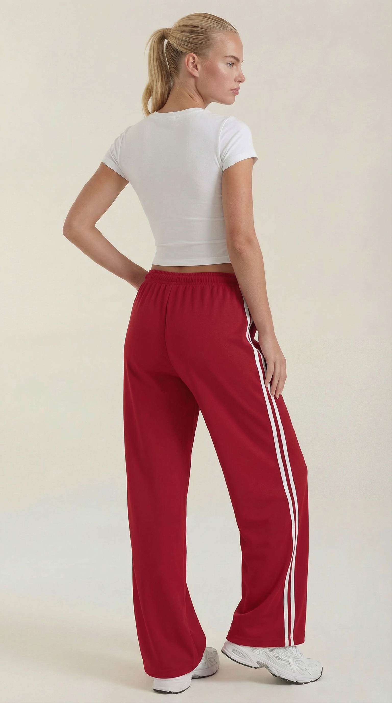 Women’s wide leg track pants in red with white side stripes, relaxed wide leg fit