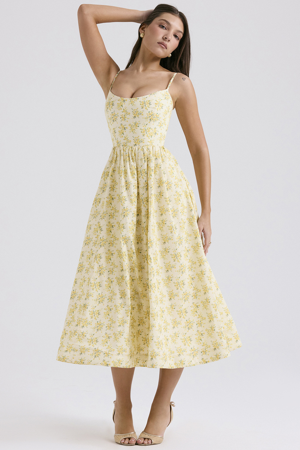 Yellow floral corset midi dress with spaghetti straps and gathered A-line skirt