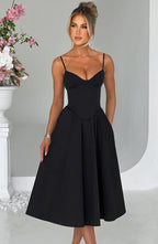 Black corset midi dress with spaghetti straps and sweetheart neckline, pleated skirt