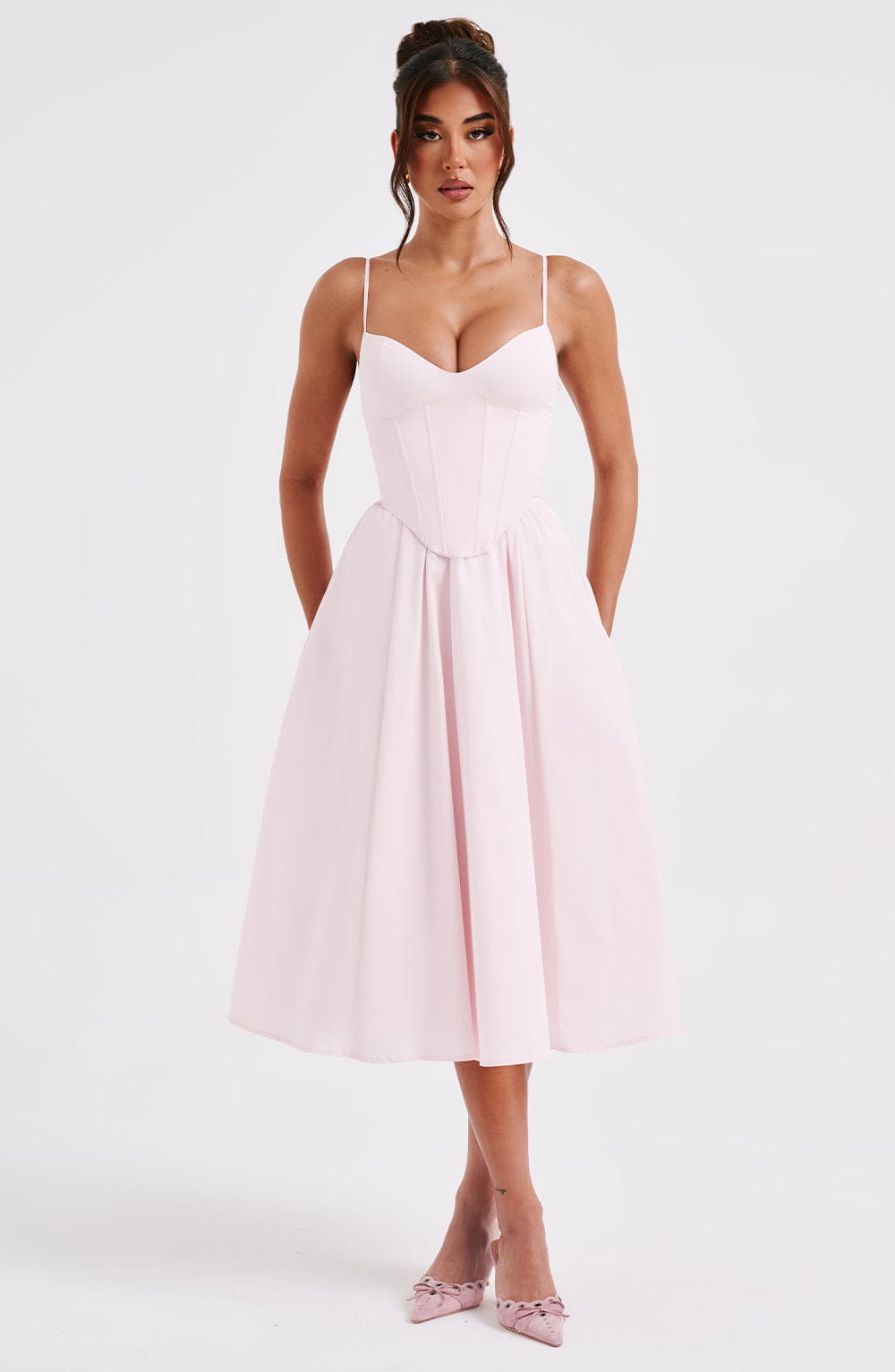 White corset midi dress with spaghetti straps and sweetheart neckline, fitted bodice