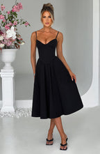 Black corset midi dress with spaghetti straps and sweetheart neckline, gathered pleated skirt