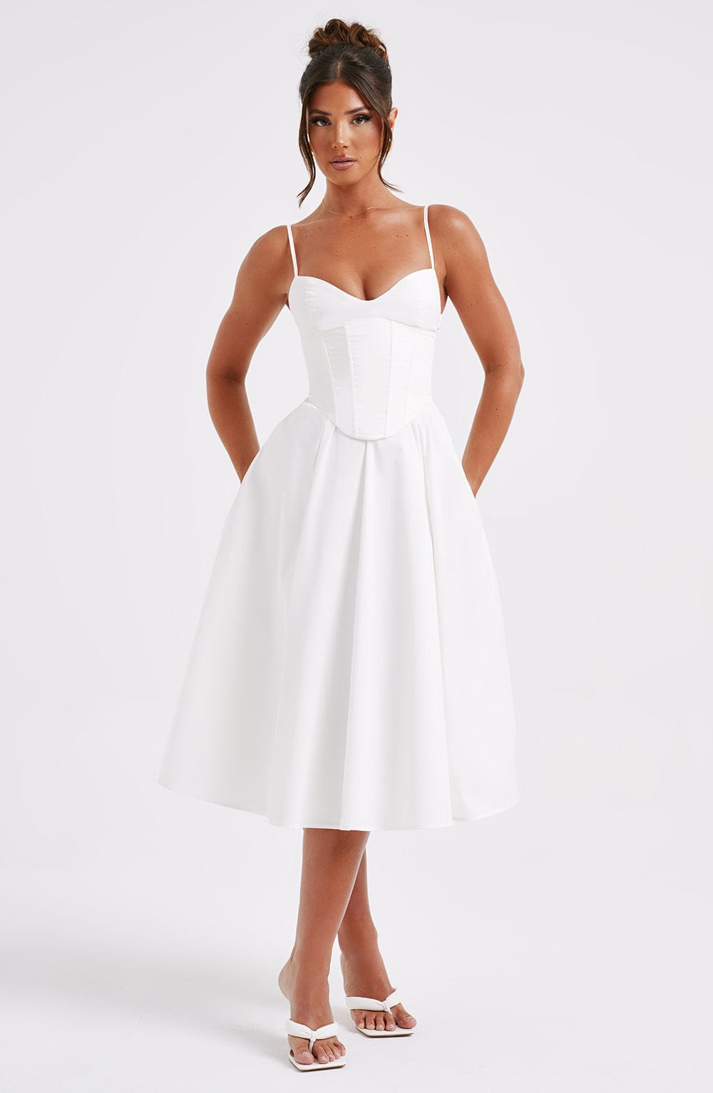 White corset midi dress with spaghetti straps and fitted waist, A-line pleated skirt
