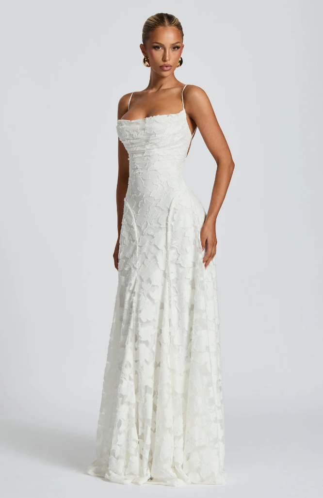 White lace maxi dress with square neckline, sleeveless fitted bodice and flared skirt