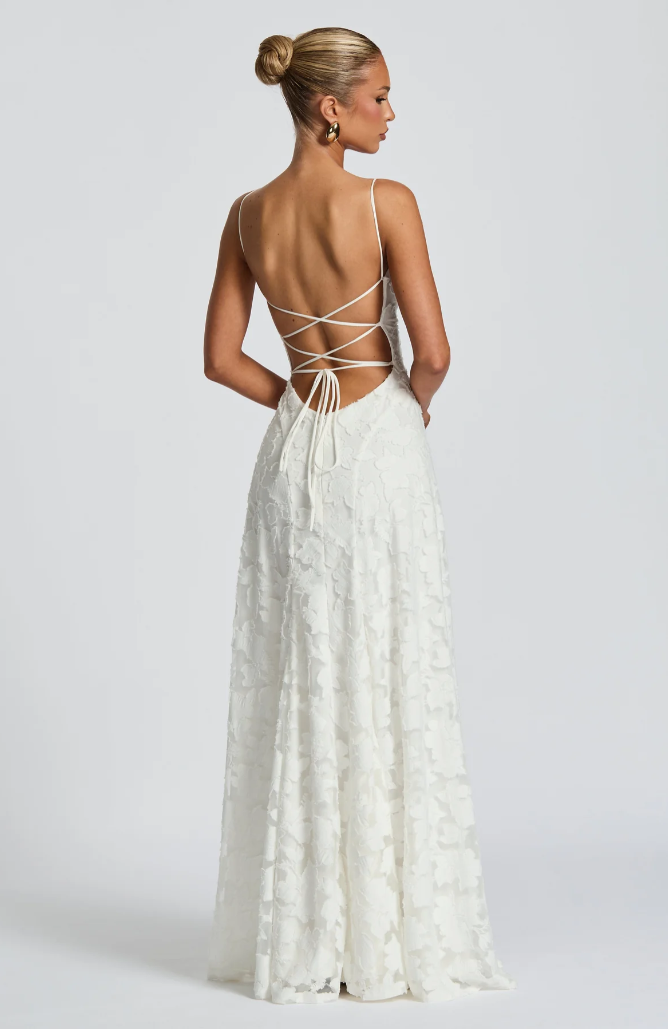 White lace maxi dress with crisscross open back straps and textured lace skirt