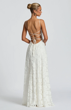 White lace maxi dress with crisscross open back straps and textured lace skirt