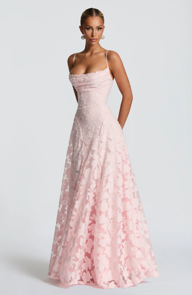 Pink lace maxi dress with thin straps, fitted bodice and full gathered lace skirt