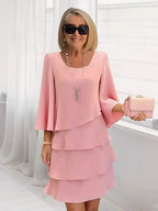 Women's pink ruffle A-line midi dress with layered tiers and three-quarter bell sleeves