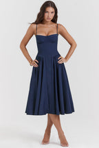 Navy blue A-line midi dress with spaghetti straps and sweetheart neckline, pleated skirt