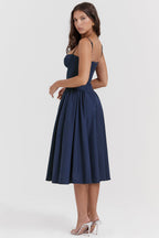 Navy blue A-line midi dress with spaghetti straps and gathered pleated skirt