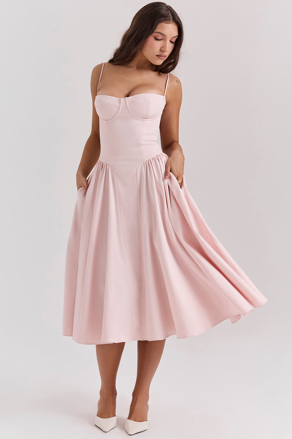 Light pink A-line midi dress with spaghetti straps and sweetheart neckline, flared skirt
