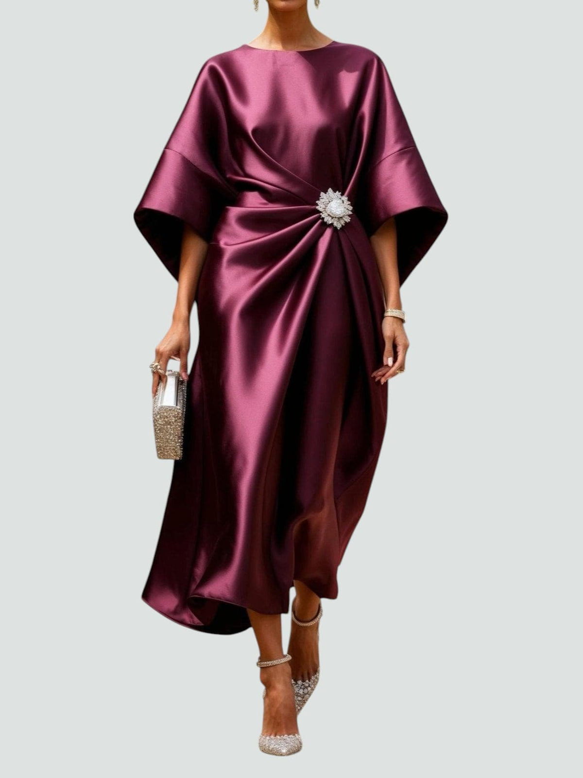 Purple satin cape-sleeve maxi dress with draped waist and silver crystal brooch