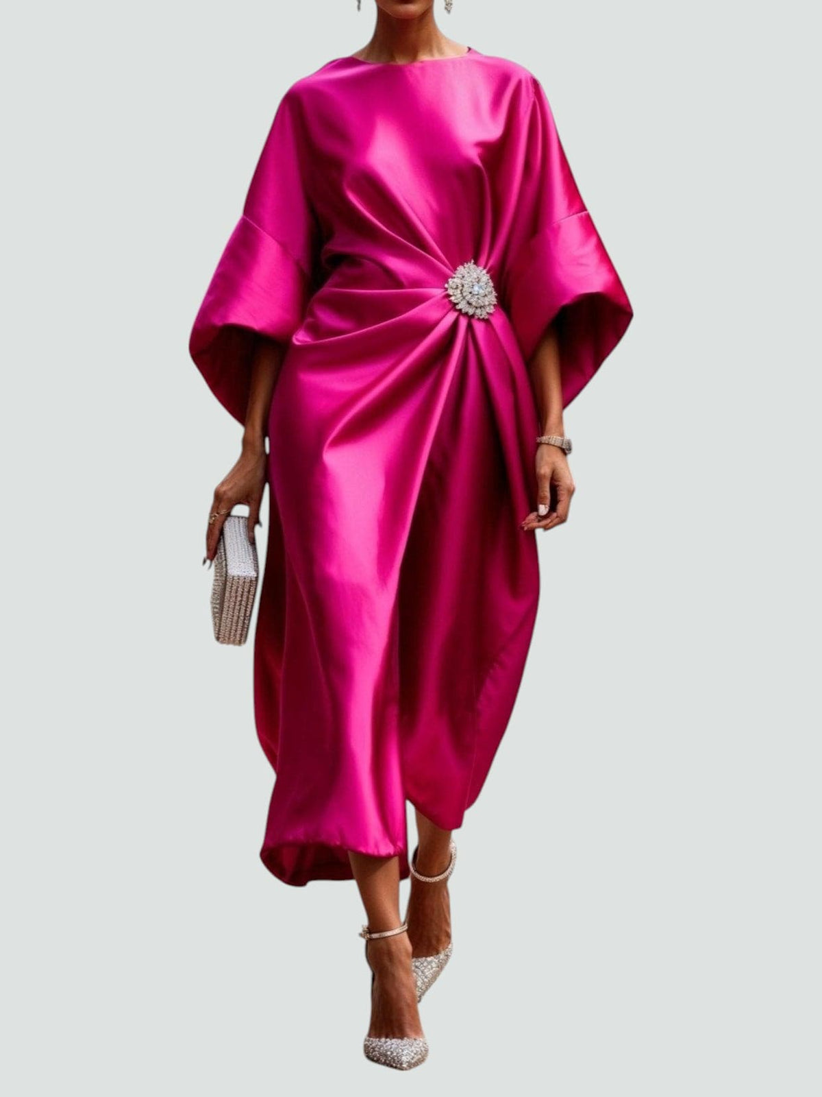 Hot pink satin cape-sleeve maxi dress with draped waist and silver crystal brooch