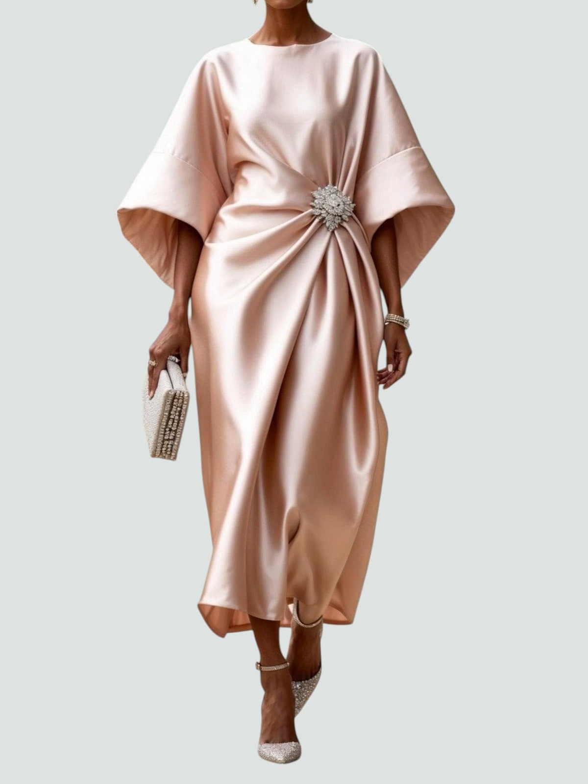 Beige satin cape-sleeve maxi dress with draped waist and silver crystal brooch