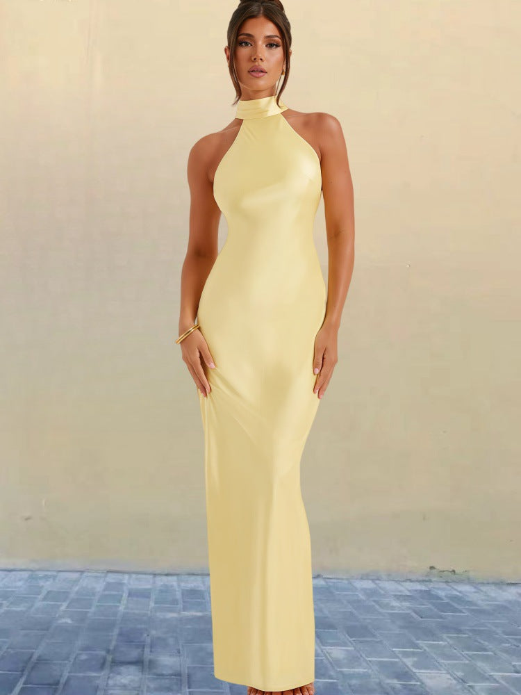 Yellow satin halter neck maxi dress, sleeveless fitted bodice and long column hem