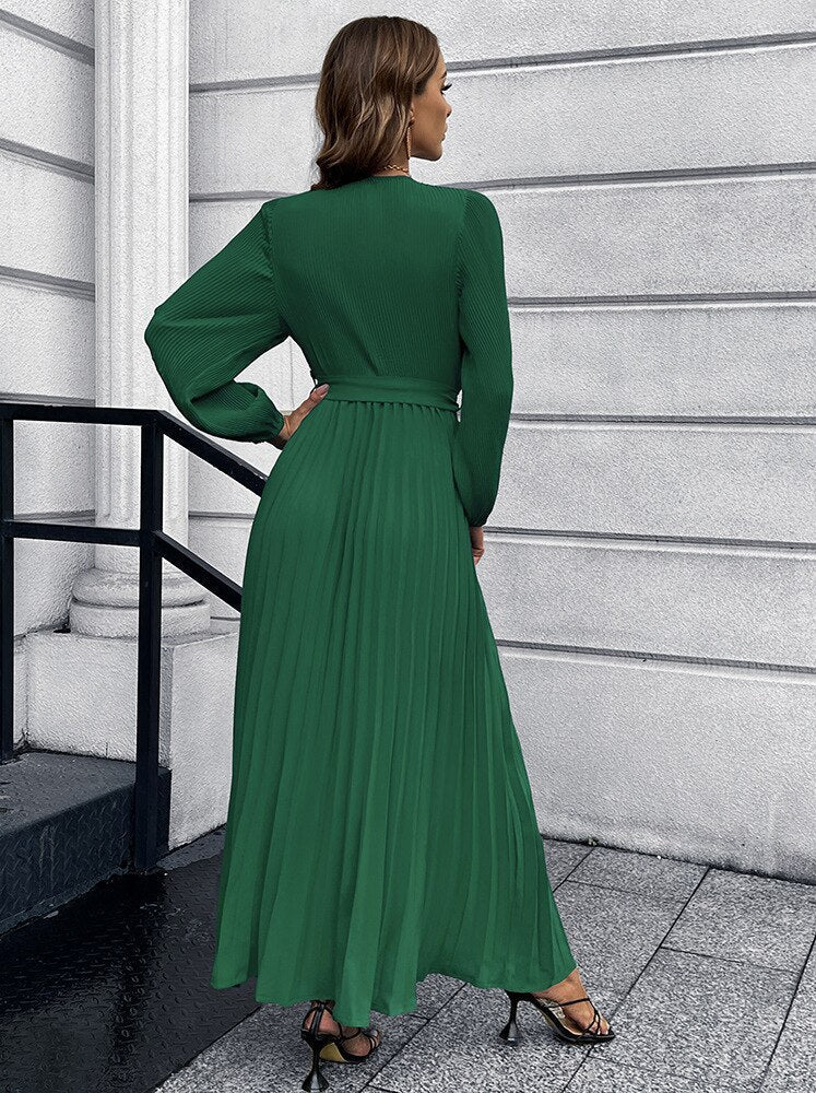 Women's green long-sleeve pleated wrap maxi dress with waist tie and V-neck