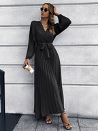 Women's black long-sleeve pleated wrap maxi dress with belted waist tie
