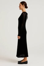 Black sheer knit maxi dress with long sleeves and flowing hem