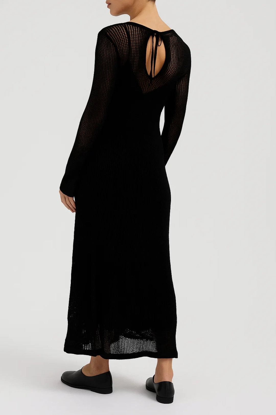 Black sheer knit maxi dress with open back detail and long sleeves