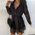 Black lace shirt dress with long sleeves, waist tie, button front, scalloped hem.