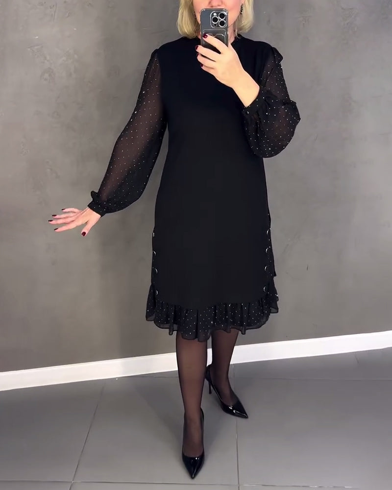 Black midi shift dress with long sheer polka-dot sleeves and ruffled hem