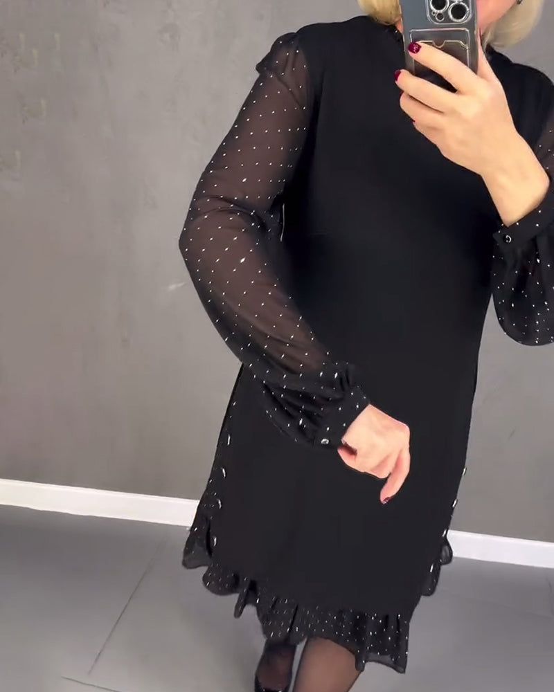 Black midi shift dress with sheer polka-dot puff sleeves and ruffled hem