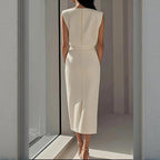 Ivory sleeveless midi dress back view with fitted waist and center seam