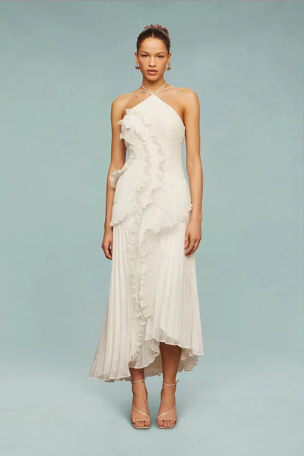 White spiral ruffle halter dress with layered ruffle trim and asymmetrical midi hem