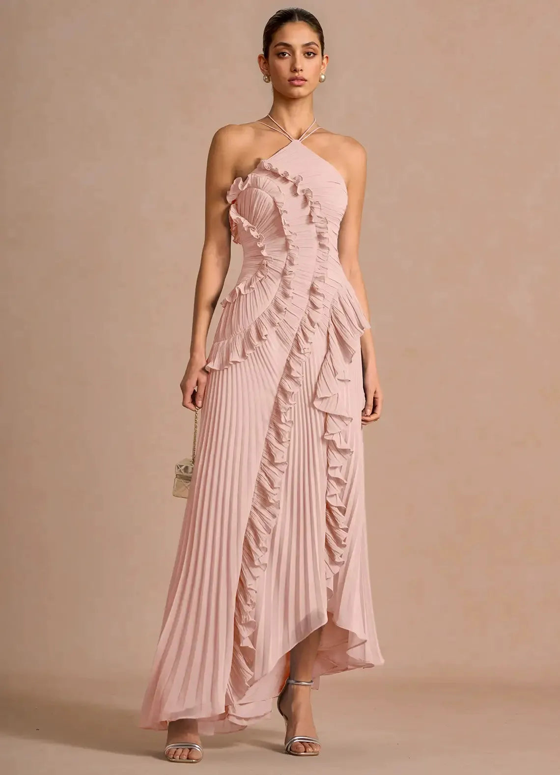 Light pink spiral ruffle halter dress with layered ruffle panels and asymmetrical midi hem