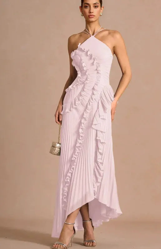 Pale pink spiral ruffle halter dress with tiered ruffles and crisscross halter neckline